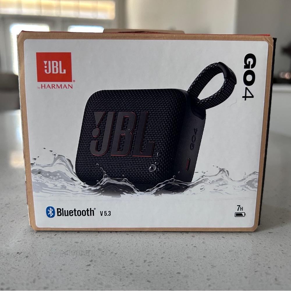 JBL GO 4 Portable Bluetooth Speaker - Black with Red Logo Accent